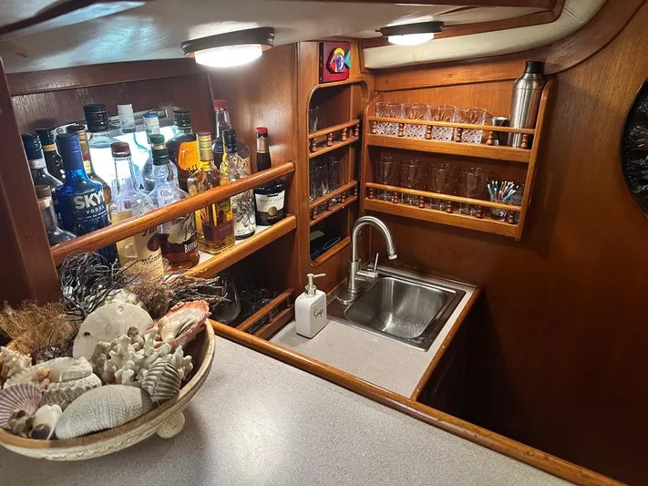  Yacht Photos Pics 1984 Irwin Cutter Ketch interior with bar, sink, and decorative seashells.