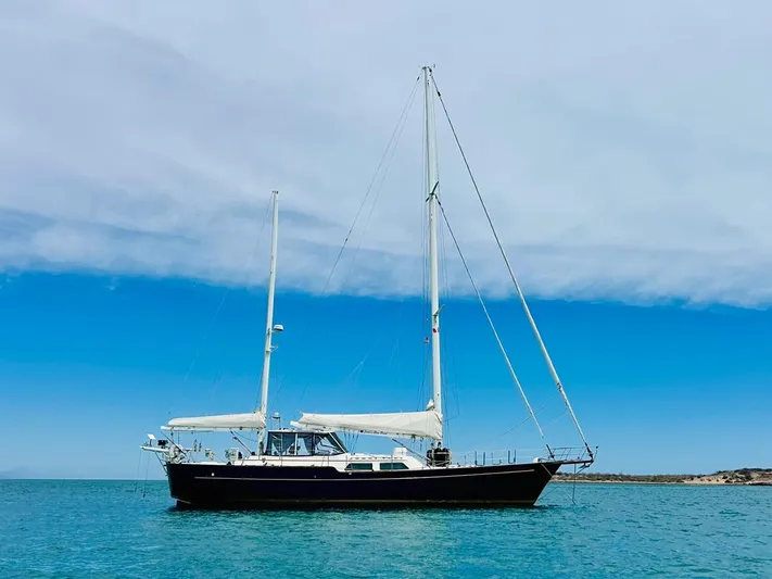  Yacht Photos Pics 1984 Irwin Cutter Ketch sailboat on calm blue sea under clear sky.