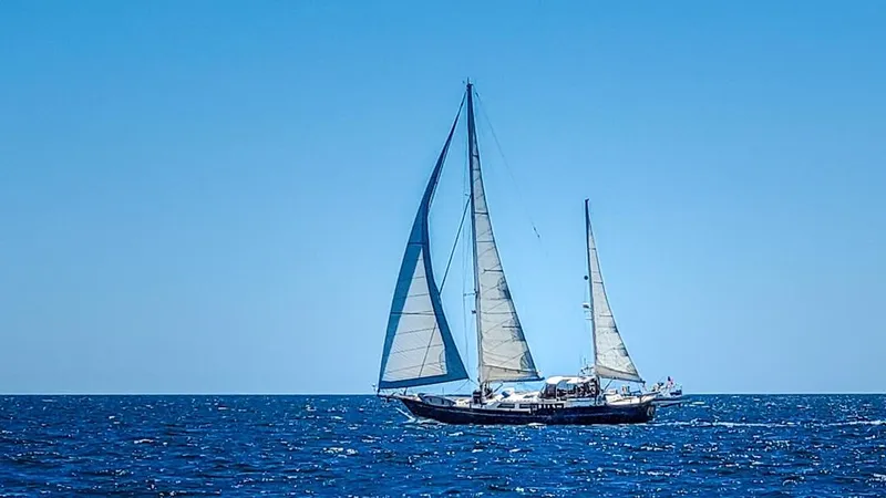 Yacht Photos Pics 1984 Irwin Cutter Ketch sailing on open sea under clear blue sky.