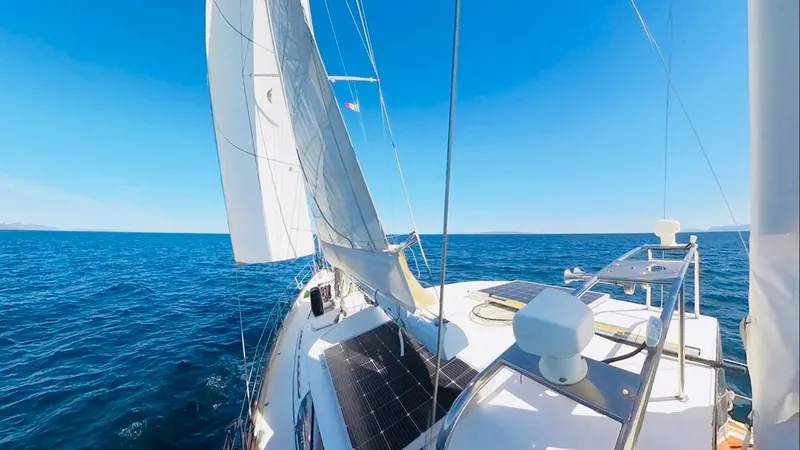  Yacht Photos Pics Sailing on a 1984 Irwin Cutter Ketch under clear blue skies.