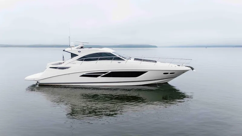  Yacht Photos Pics 2013 Sea Ray 510 Sundancer yacht on calm water, side view.