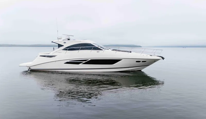  Yacht Photos Pics 2013 Sea Ray 510 Sundancer yacht on calm water, side view.