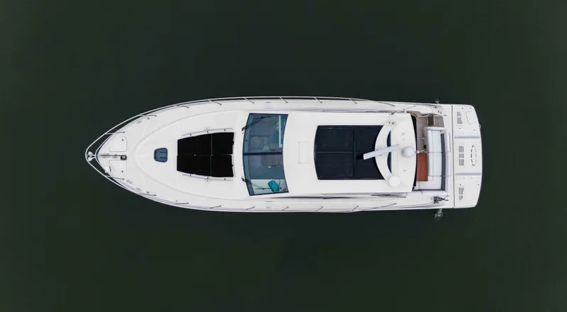  Yacht Photos Pics Aerial view of 2013 Sea Ray 510 Sundancer yacht on calm water.