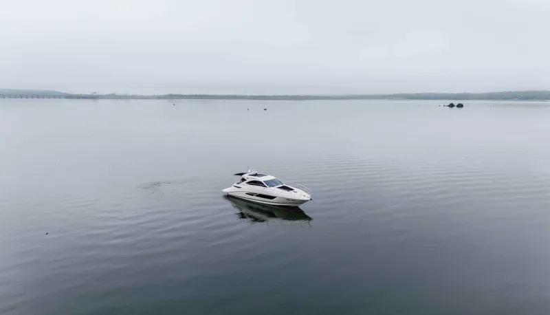  Yacht Photos Pics 2013 Sea Ray 510 Sundancer yacht on calm, misty waters.