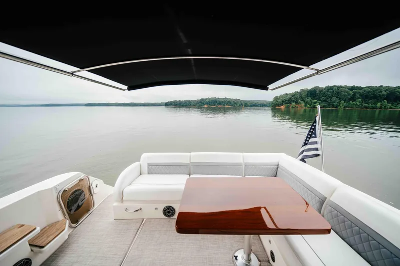  Yacht Photos Pics Luxurious 2013 Sea Ray 510 Sundancer yacht with elegant seating and scenic lake view.