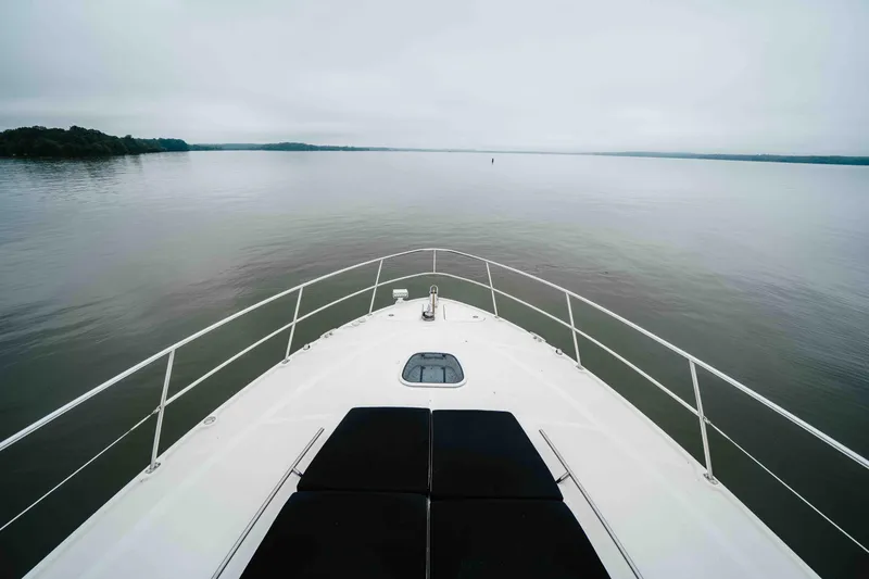  Yacht Photos Pics Bow view of 2013 Sea Ray 510 Sundancer on calm waters.