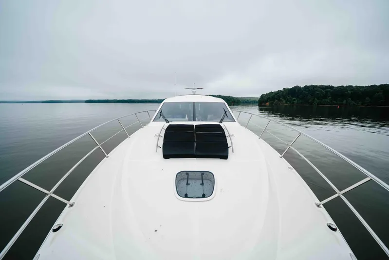  Yacht Photos Pics 2013 Sea Ray 510 Sundancer yacht on calm water, overcast sky.