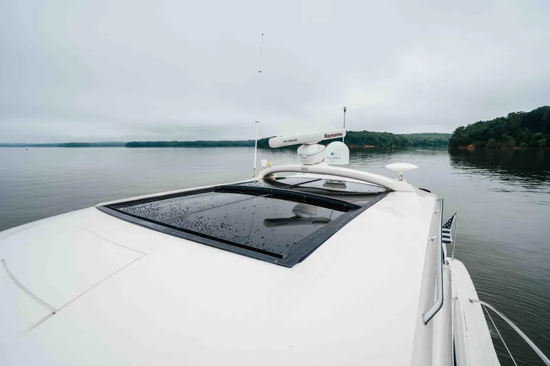  Yacht Photos Pics 2013 Sea Ray 510 Sundancer yacht on calm water, featuring sleek design and advanced navigation equipment.