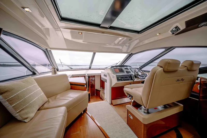  Yacht Photos Pics Luxurious interior of 2013 Sea Ray 510 Sundancer yacht with leather seating and panoramic windows.