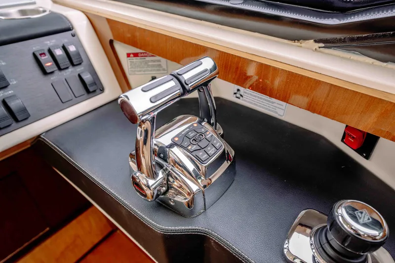  Yacht Photos Pics Control panel of a 2013 Sea Ray 510 Sundancer yacht with throttle and joystick.