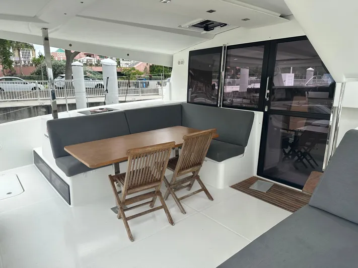 Brave Coquina Yacht Photos Pics Outdoor seating area on a 2020 Fountaine Pajot Lucia 40 catamaran.