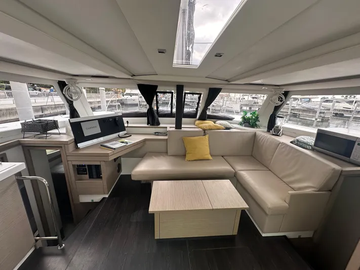 Brave Coquina Yacht Photos Pics Modern interior of 2020 Fountaine Pajot Lucia 40 catamaran with spacious seating area.