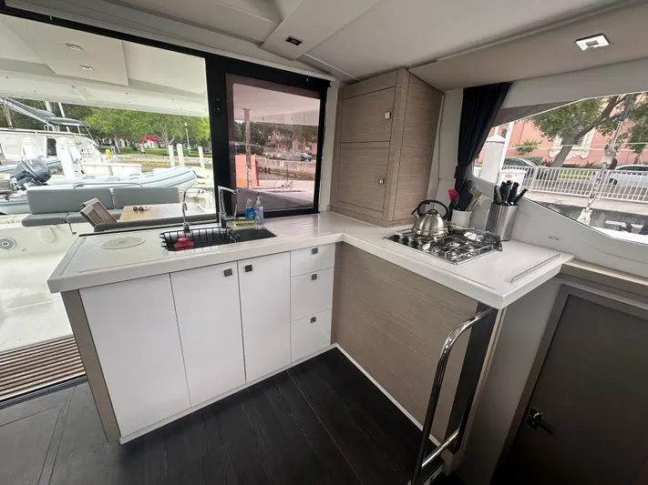 Brave Coquina Yacht Photos Pics Modern kitchen in 2020 Fountaine Pajot Lucia 40 catamaran with stove and sink.