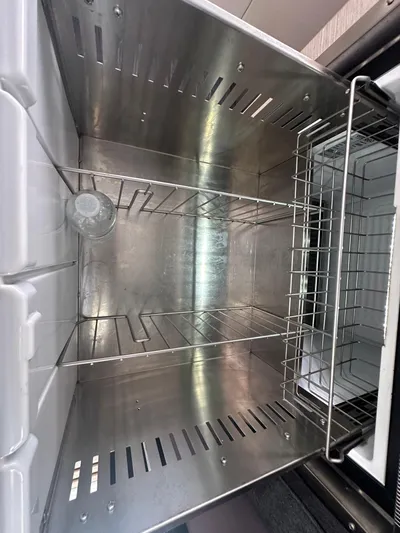 Brave Coquina Yacht Photos Pics Stainless steel refrigerator interior of 2020 Fountaine Pajot Lucia 40 yacht.