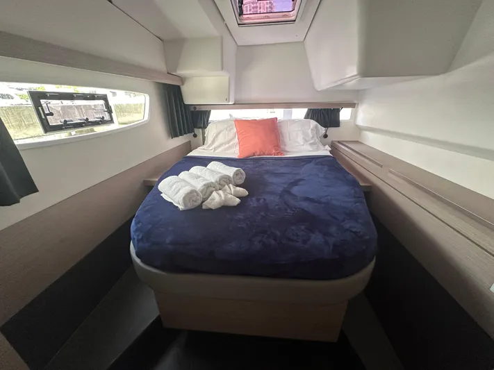 Brave Coquina Yacht Photos Pics 2020 Fountaine Pajot Lucia 40 cabin with bed, windows, and skylight.