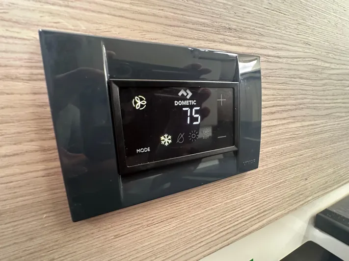 Brave Coquina Yacht Photos Pics Digital thermostat on 2020 Fountaine Pajot Lucia 40 yacht, displaying 75 degrees.