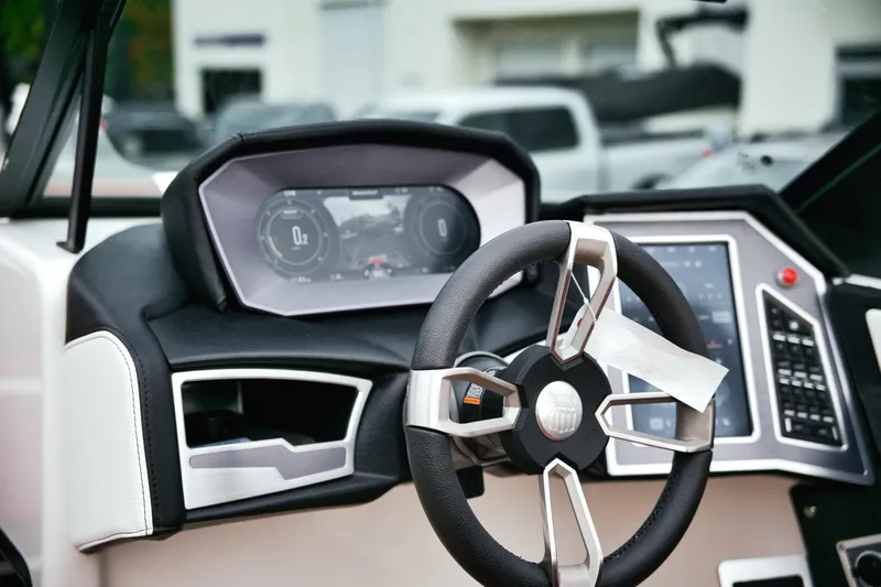  Yacht Photos Pics 2022 MasterCraft X24 dashboard with modern steering wheel and digital display.