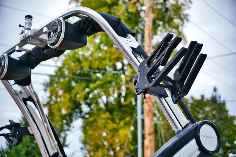  Yacht Photos Pics 2022 MasterCraft X24 wakeboard tower with speakers and board racks.