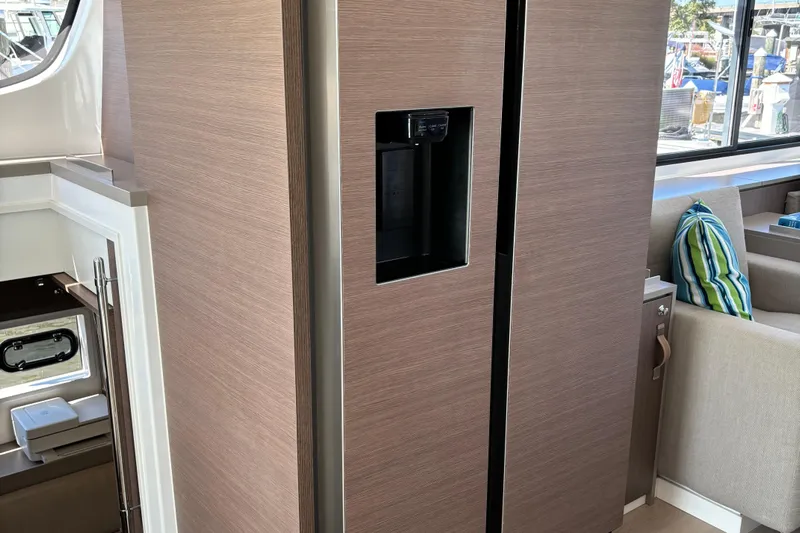 C Dreams Yacht Photos Pics Modern kitchen area in 2022 Bali 4.6 yacht with sleek wood paneling.