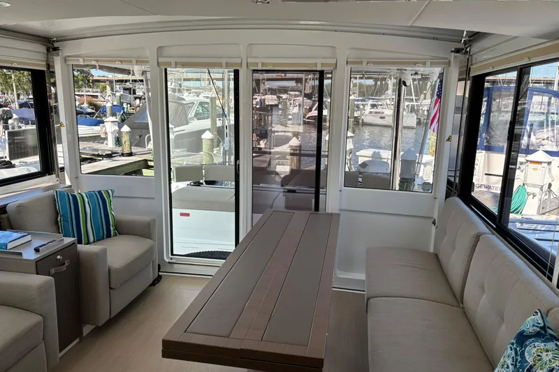 C Dreams Yacht Photos Pics Luxurious interior of 2022 Bali 4.6 yacht with modern seating and marina view.