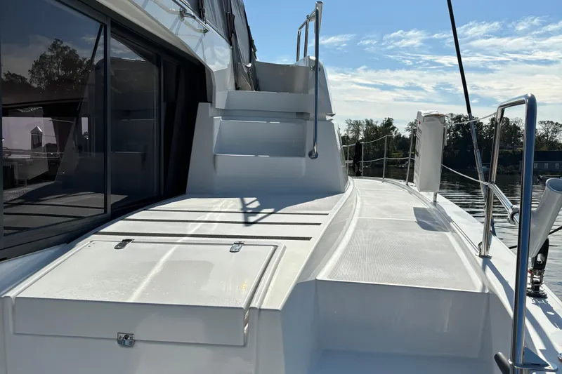 C Dreams Yacht Photos Pics 2022 Bali 4.6 yacht deck with stairs, sleek design, and waterfront view.