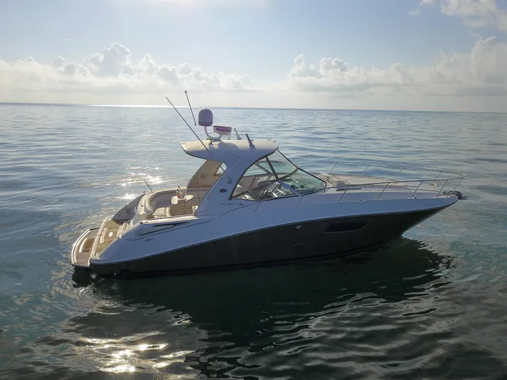  Yacht Photos Pics 2009 Sea Ray 350 Sundancer yacht on calm ocean waters.