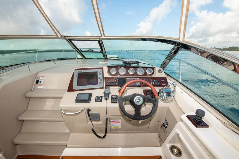  Yacht Photos Pics 2009 Sea Ray 350 Sundancer helm with navigation equipment and ocean view.