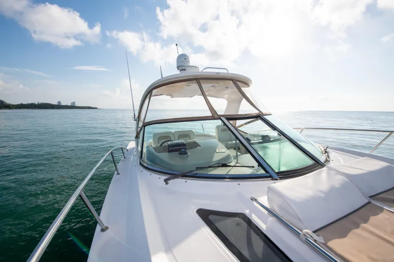  Yacht Photos Pics 2009 Sea Ray 350 Sundancer yacht cruising on open water.