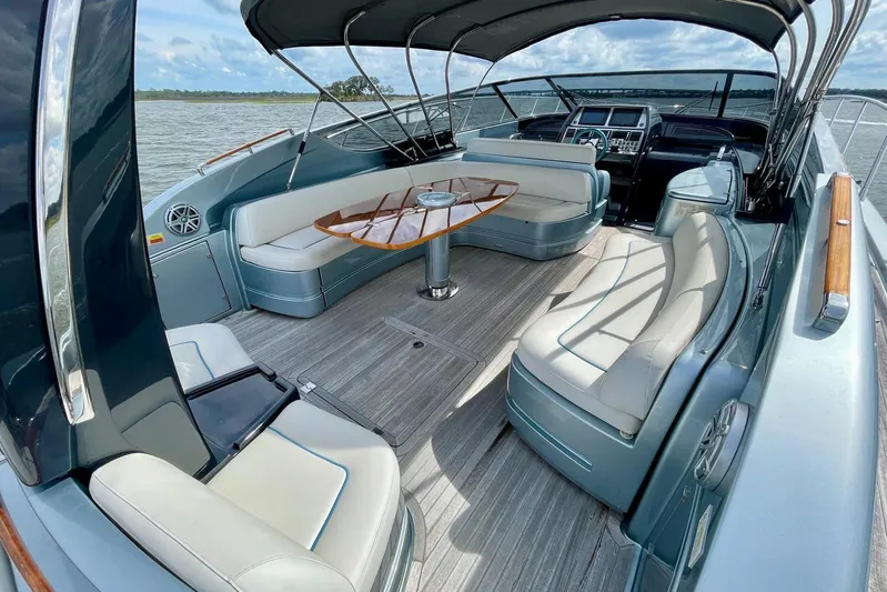 Andiamo Yacht Photos Pics Luxurious 2016 Riva 63 Virtus yacht interior with elegant seating and sleek design.