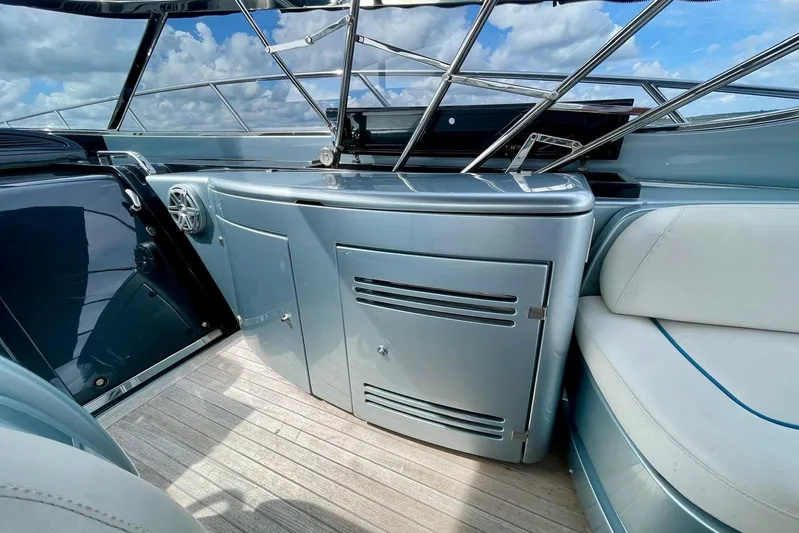Andiamo Yacht Photos Pics 2016 Riva 63 Virtus yacht interior with sleek cabinetry and luxurious seating.