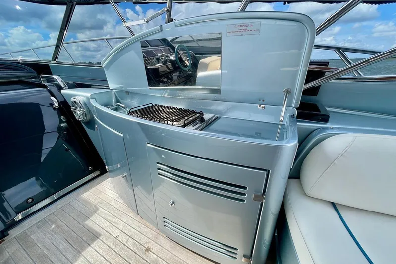 Andiamo Yacht Photos Pics Luxury outdoor kitchen on 2016 Riva 63 Virtus yacht with grill and seating.