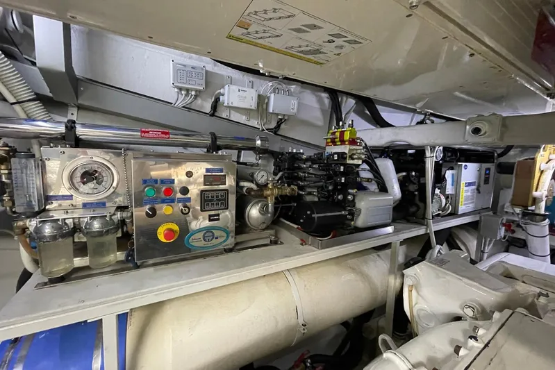 Andiamo Yacht Photos Pics Engine room of 2016 Riva 63 Virtus yacht with control panels and machinery.