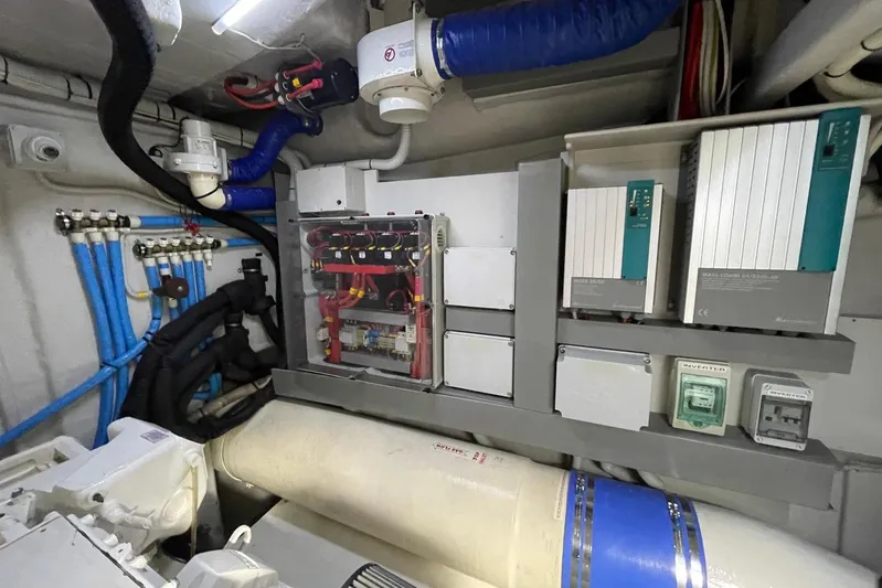 Andiamo Yacht Photos Pics Engine room of 2016 Riva 63 Virtus yacht with electrical systems and wiring.