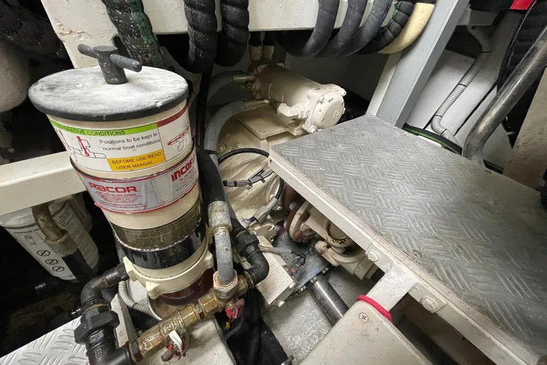 Andiamo Yacht Photos Pics Engine room of 2016 Riva 63 Virtus yacht, showcasing mechanical components and piping.