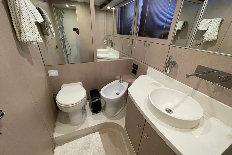 Andiamo Yacht Photos Pics Luxurious bathroom interior of 2016 Riva 63 Virtus yacht with modern fixtures.