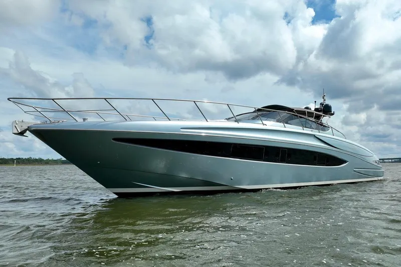 Andiamo Yacht Photos Pics 2016 Riva 63 Virtus yacht cruising on open water under cloudy skies.