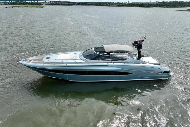 Andiamo Yacht Photos Pics 2016 Riva 63 Virtus luxury yacht cruising on a calm river.