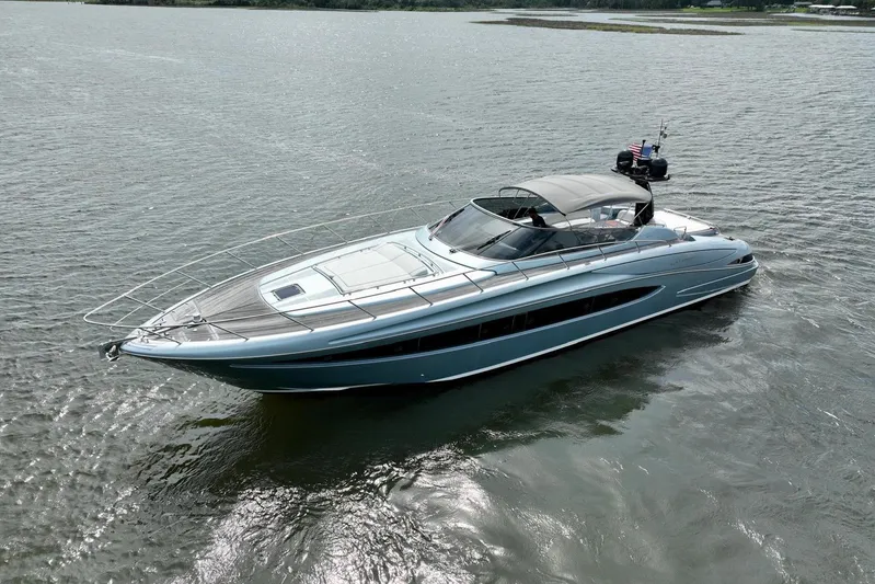 Andiamo Yacht Photos Pics Luxurious 2016 Riva 63 Virtus yacht cruising on calm waters, showcasing sleek design and elegance.