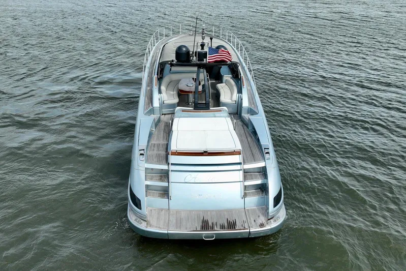 Andiamo Yacht Photos Pics 2016 Riva 63 Virtus luxury yacht on open water, rear view with American flag.