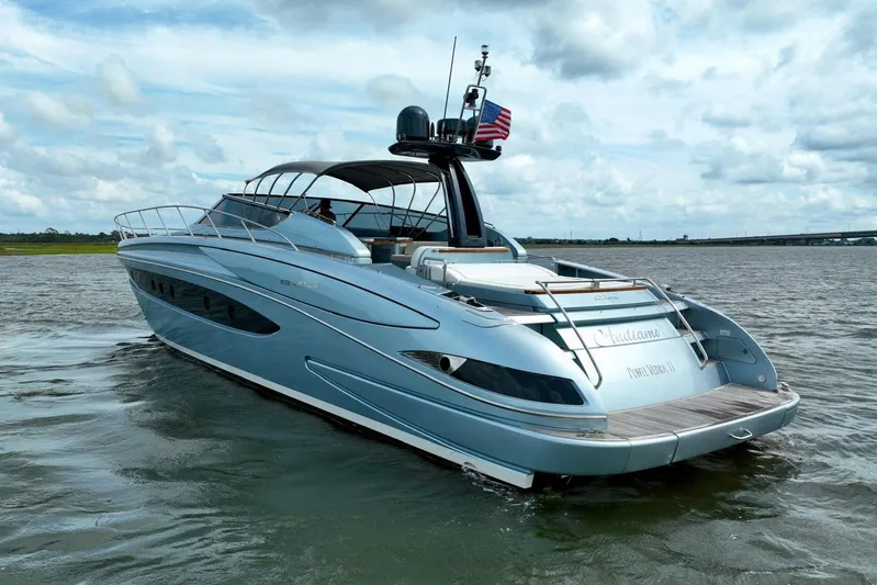 Andiamo Yacht Photos Pics 2016 Riva 63 Virtus yacht cruising on open water under a cloudy sky.