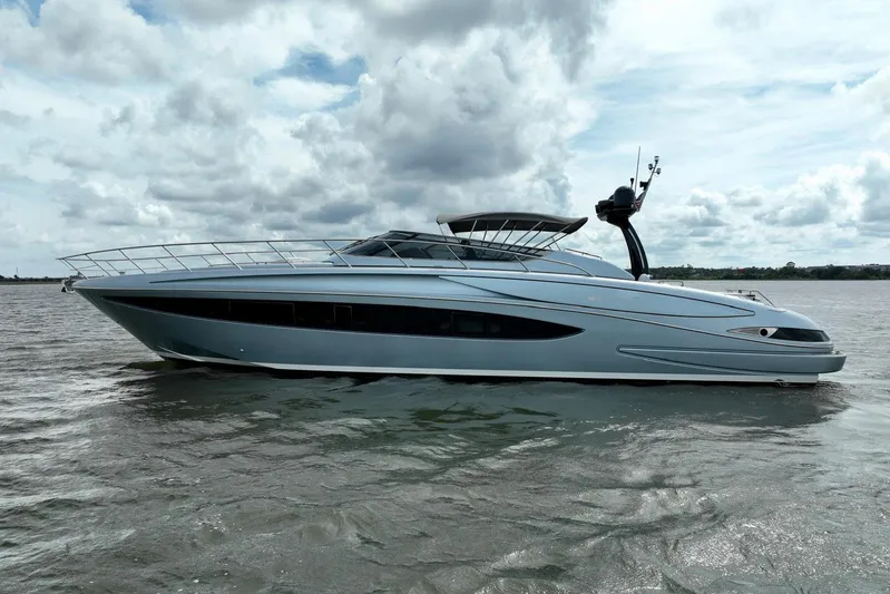 Andiamo Yacht Photos Pics 2016 Riva 63 Virtus yacht on open water under cloudy sky.