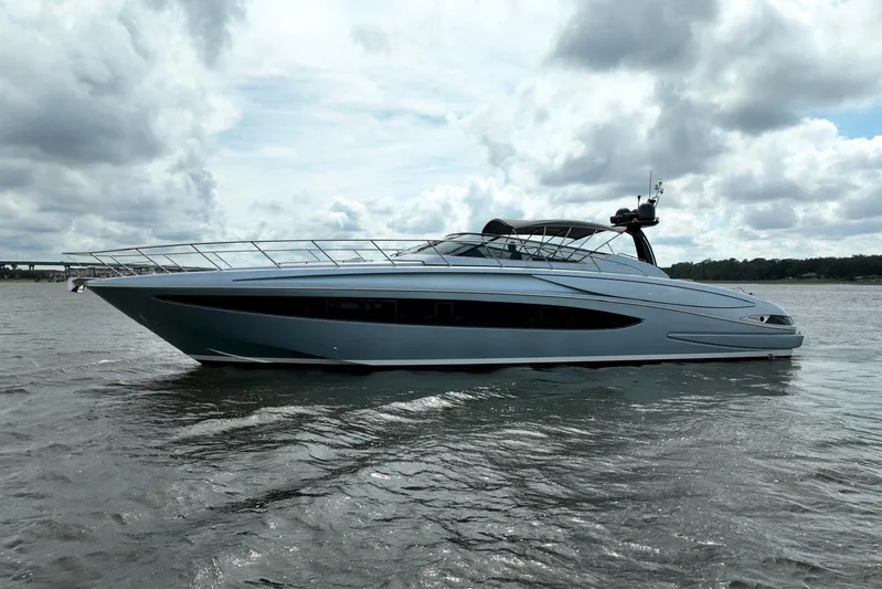 Andiamo Yacht Photos Pics 2016 Riva 63 Virtus luxury yacht on calm waters under cloudy skies.