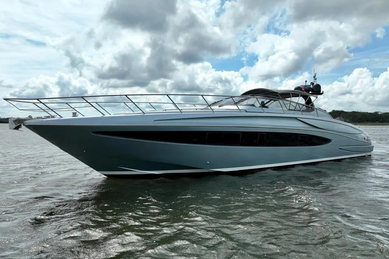 Andiamo Yacht Photos Pics 2016 Riva 63 Virtus yacht on water under cloudy sky.