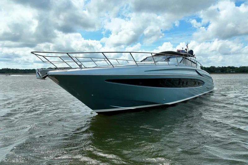 Andiamo Yacht Photos Pics 2016 Riva 63 Virtus yacht on water under cloudy sky.