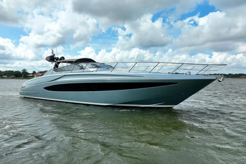 Andiamo Yacht Photos Pics 2016 Riva 63 Virtus yacht cruising on a calm, cloudy day.