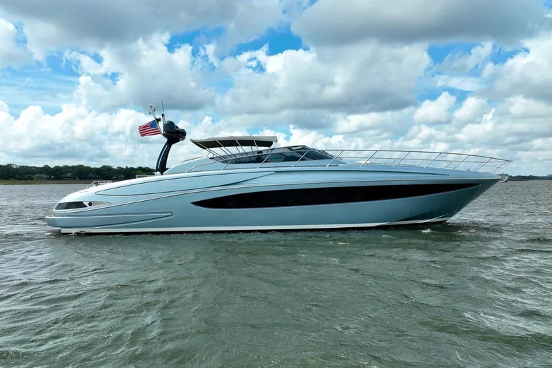 Andiamo Yacht Photos Pics 2016 Riva 63 Virtus yacht cruising on a sunny day with an American flag.