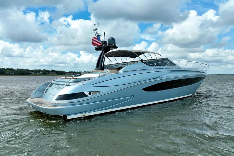 Andiamo Yacht Photos Pics Luxury 2016 Riva 63 Virtus yacht on open water under cloudy sky.