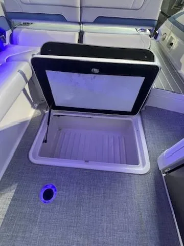 Yacht Photos Pics 2024 Formula 310 Bowrider OB storage compartment with open hatch.