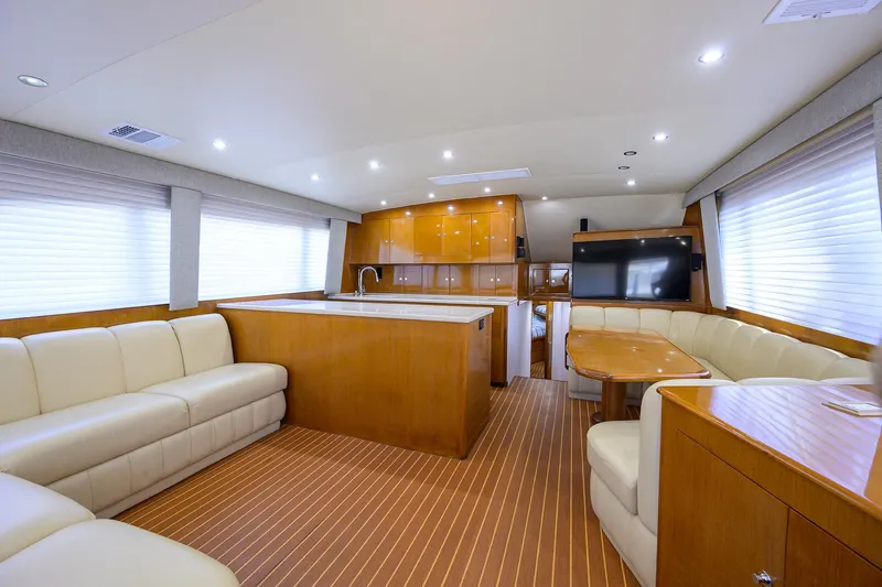 Sea Keeper 9 Yacht Photos Pics Luxurious interior of a 2005 Post 53 Convertible yacht with elegant seating and modern amenities.