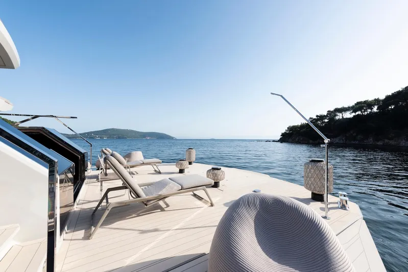  Yacht Photos Pics Luxurious deck of 2025 Mazu Yachts 92 DS with sun loungers and ocean view.